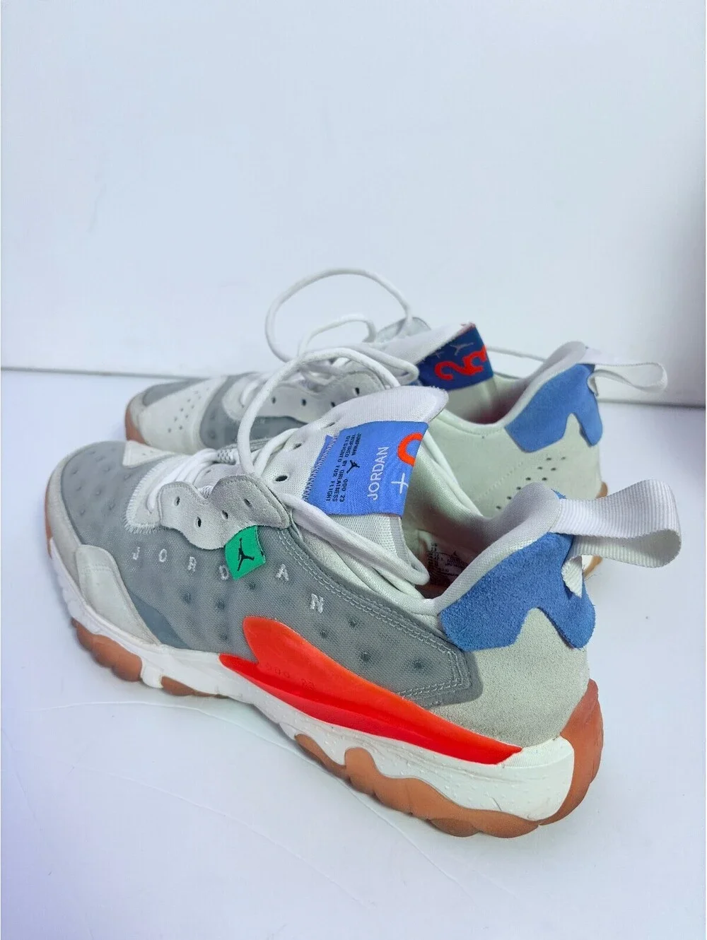 Jordan React white gray sneakers with orange outsole